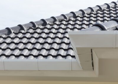 white gutter on the roof top of house