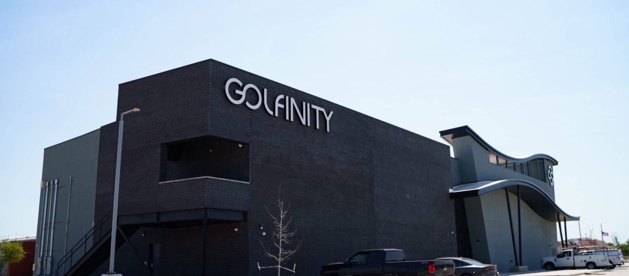 A modern building and a car parked in front of it